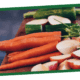 Fresh carrots with green tops on a wooden cutting board.