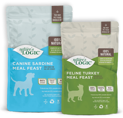 nutrition-bags Two pet food bags side by side: a blue Canine Sardine Meal Feast and a green Feline Turkey Meal Feast, both 100% natural.